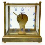 Table clock with brass structure and bevelled glass, switzerland production 60s. Electric movement