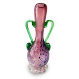 Production on Murano glass vase amethyst with white vitreous paste applications in green glass