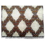 Berber carpet, Morocco, 1970, cm. 199x115, warp, weave and fleece wool. On a white background a
