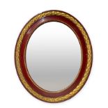 Oval Mirror in lacquered and gilded frame, twentieth century. H 92x79 cm.