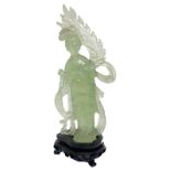 Jade light green statuette depicting Guanine. Provenance Beijing. Early '900S. H 20. H cm with base