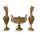 Gilt metal triptych composed of two jars with the center giatta with two griffins as handles. 20th