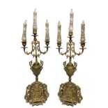 Pair of gilded bronze candlesticks with three lights, nineteenth century. H 52 cm.