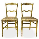 Pair of gilded wooden chairs chiavarine, late nineteenth century. Silk cloth seat. Lack of a side