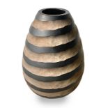 Vase, Italian production. In wood carved along the surface with circular pattern. Years 60. H cm 35
