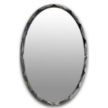 Cristalart, mirror of elliptical shape with molature contrast in bronze tones along the edge.