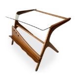 Italian Production, light wood coffee table glass top and magazine rack. Years 50. 46x60x50 cm.