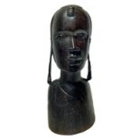 Wooden sculpture depicting woman's face with earrings, Africa. H cm 42 cm base 18. Small lack in