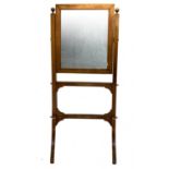Tilting vanity in walnut with inlays and light wood countour. Mercury mirror on both sides, late