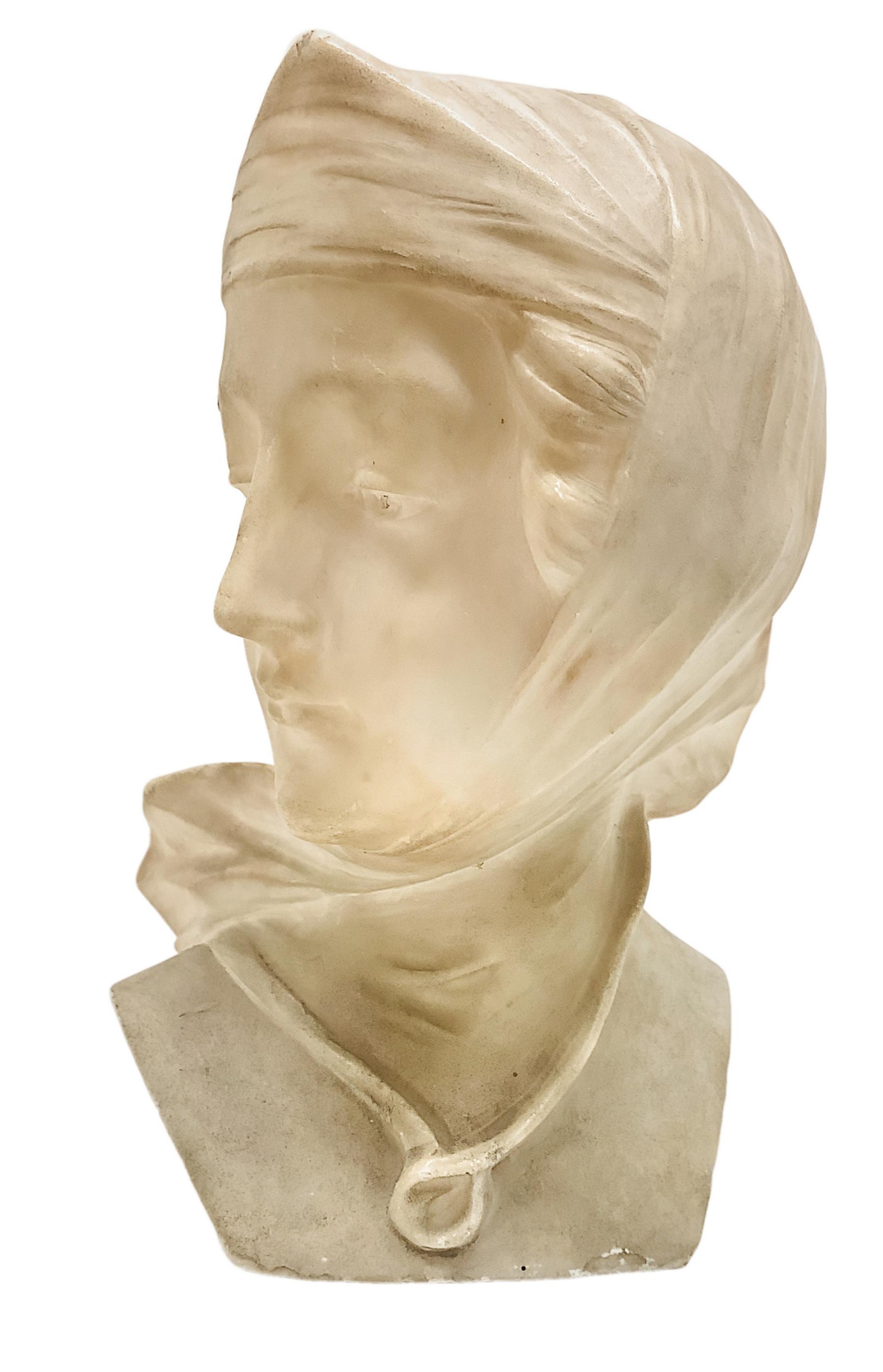 White marble statuette depicting a young woman with fulare head. H cm 19. Base 7x9 cm.