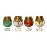 Four glasses from Murano glass cognac in four colors with border and gold decorations. H 15 Cm.