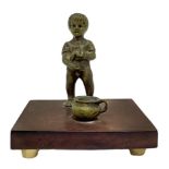 Small bronze depicting child with pot. H 6.2 cm. Base cm 7,5x6x1.