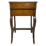Bedside table with two drawers, Sicily, XIX century. In walnut wood with saber feet. H 90 cm x56x40