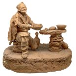 terracotta sculpture depicting monochrome old eating, Bottega Vaccaro, Caltagirone. H 24 cm Base