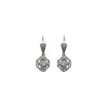 Earrings with pendants in the dome in white gold and diamonds. Gr 6.6