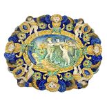 Majolica plate with putti, central Italy, nineteenth century. Cm 25x29,5.