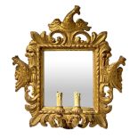 Mirror in gilded wood with two candles. 18th/19th century. Sculpted and engraved with crowned
