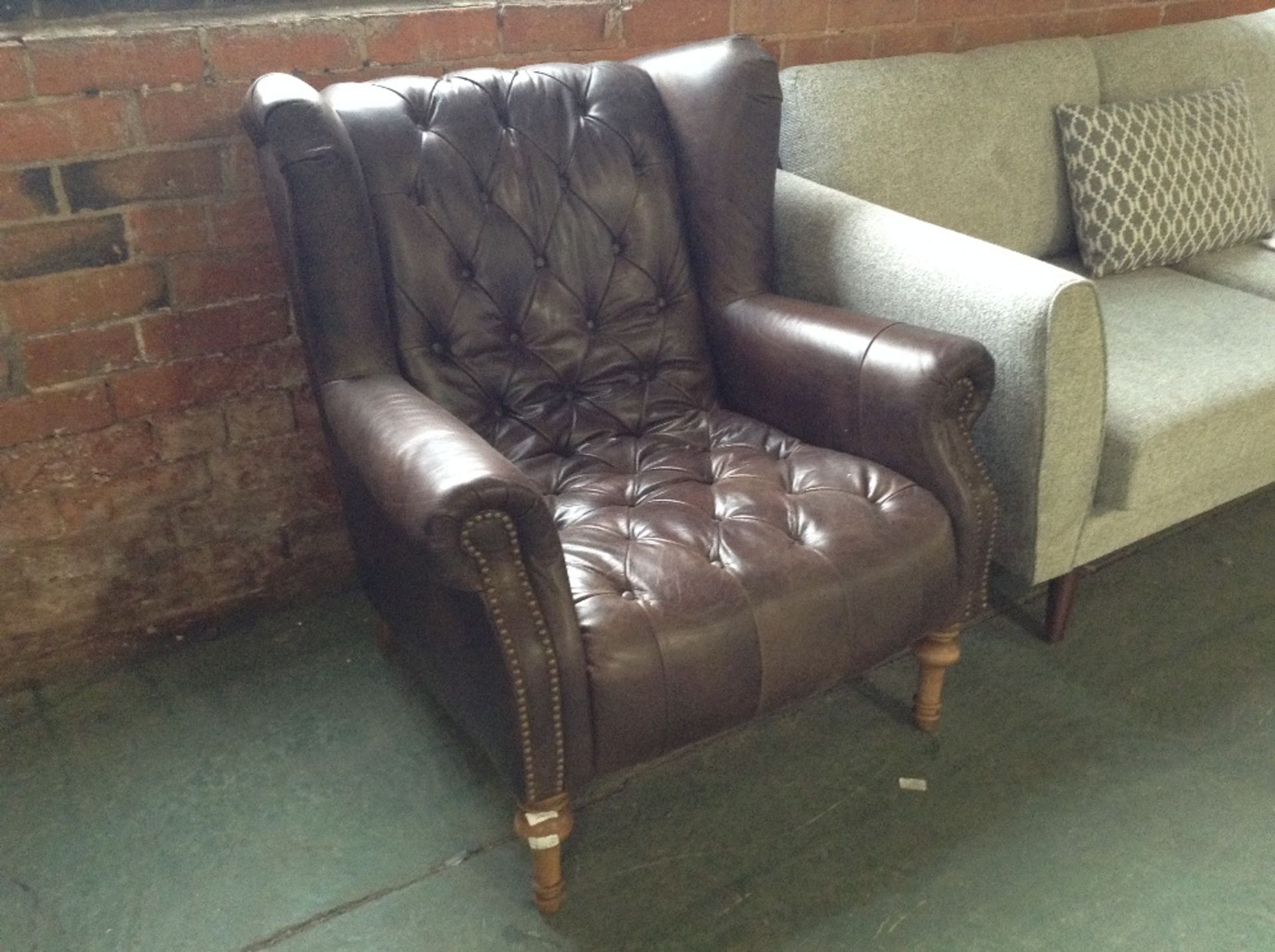 BROWN LEATHER BUTTON BACK WING CHAIR (ST44-511192)