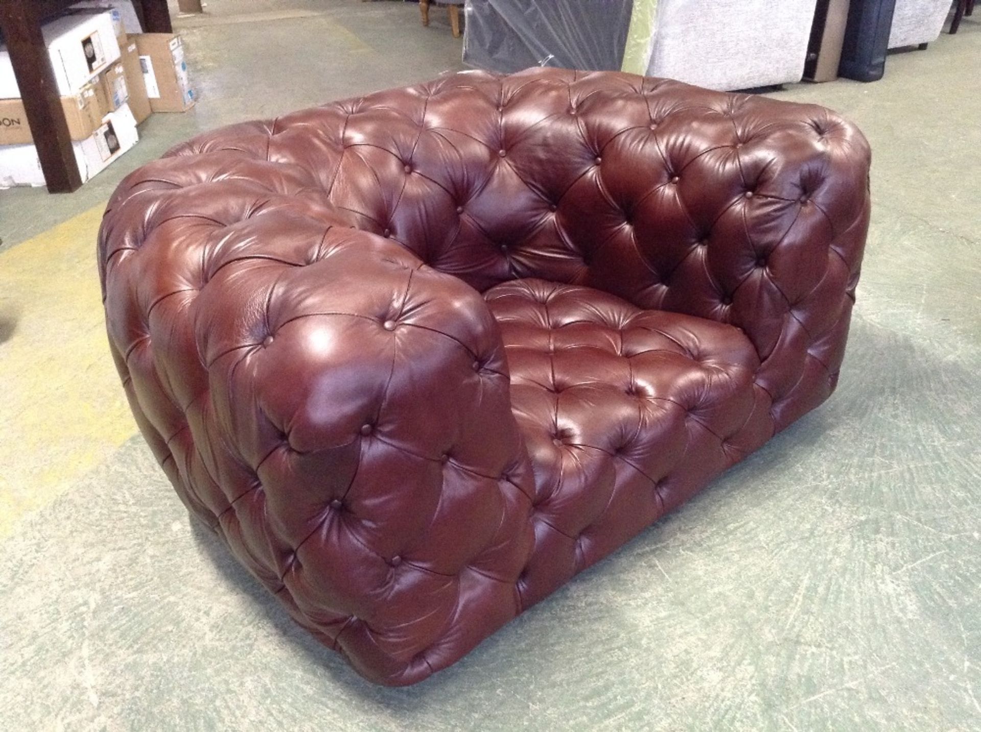 BROWN LEATHER BUTTON BACK SNUG CHAIR