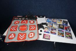 Various PlayStation 2 Games and Accessories Including; 2no. Dance Mats, 2no. Microphones and 2no.
