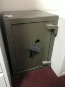 Green Metal Safe with Key, Please Note: This Lot is very heavy and is located upstairs, please