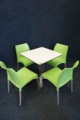 White Metal Framed Table Complete with 4no. Green Stacking Chairs as Lotted Lot is Located Main