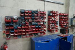 A Quantity of Spare Parts in Various Plastic Storage Bins Mounted on 5 Wall Boards