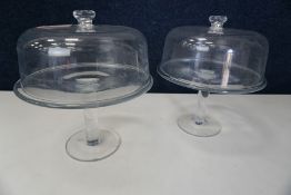 2no. Glass Cake Stands Complete with Plastic Lids