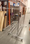 Lot of 3 Mobile Clothing Racks.