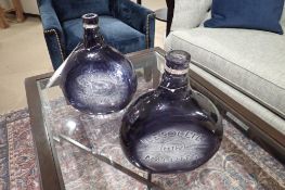 Lot of 2 Mercana Caupona II Glass Bottles.