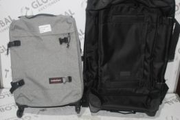 Assorted Items to Include 1 Grey Eastpack Travel Luggage Suitcase and 1 Black Eastpack Travel