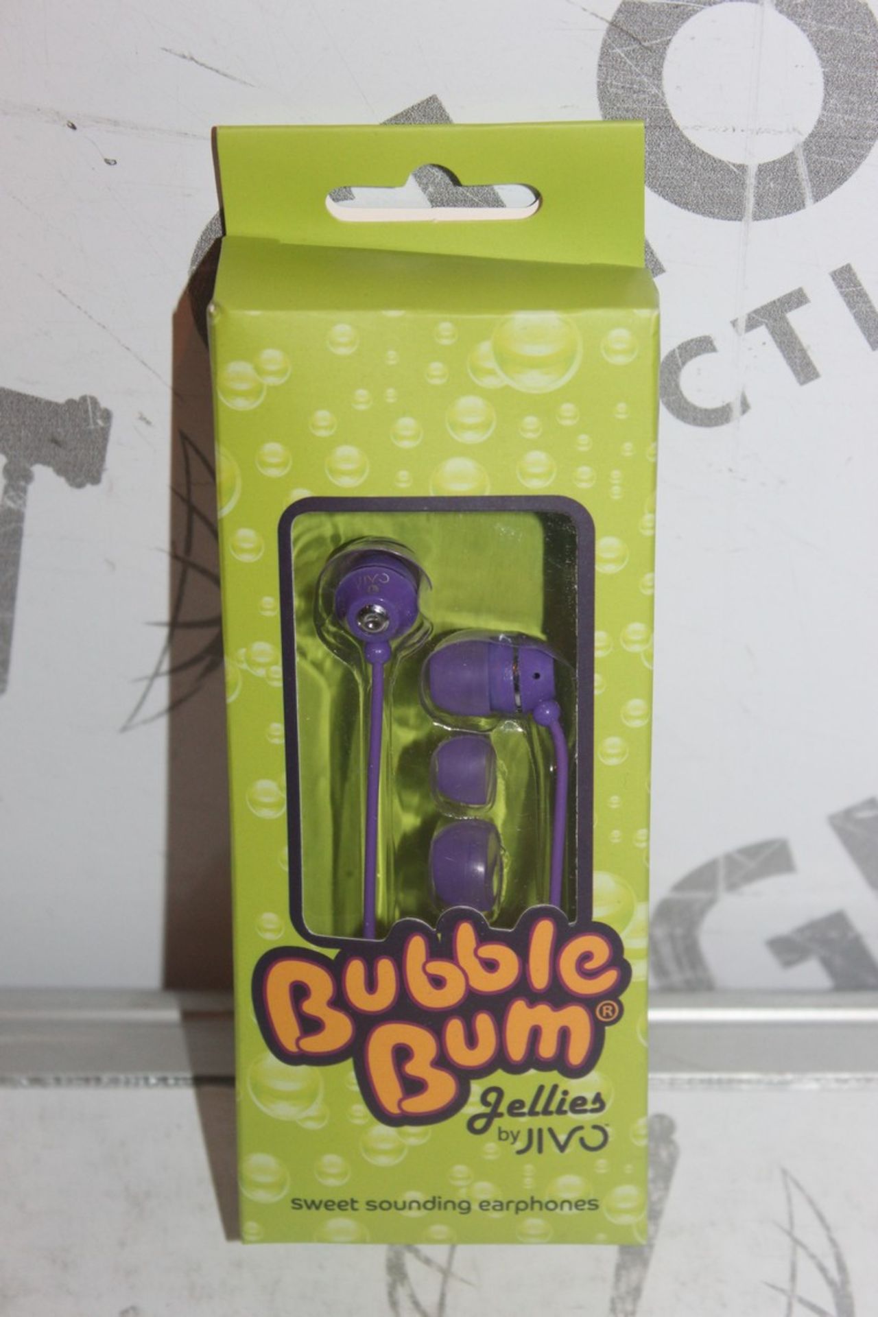 Lot to Contain 32 Assorted Items to Include Bubblegum Jellys Jivo Earphones and Bear Grylls iPhone 5