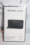 Lot To Contain Two Michael Kors essential Zipp Black Saffiano Wallets With Phone compartments,