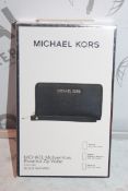 Lot To Contain Two Michael Kors essential Zipp Black Saffiano Wallets With Phone compartments,