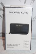 Lot To Contain Two Michael Kors essential Zipp Black Saffiano Wallets With Phone compartments,