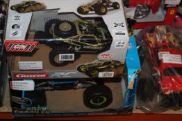 Lot To Contain 3 Assorted Boxed And Unboxed Remote Control Cars To Include A Carrera RC Dirt Buggy A
