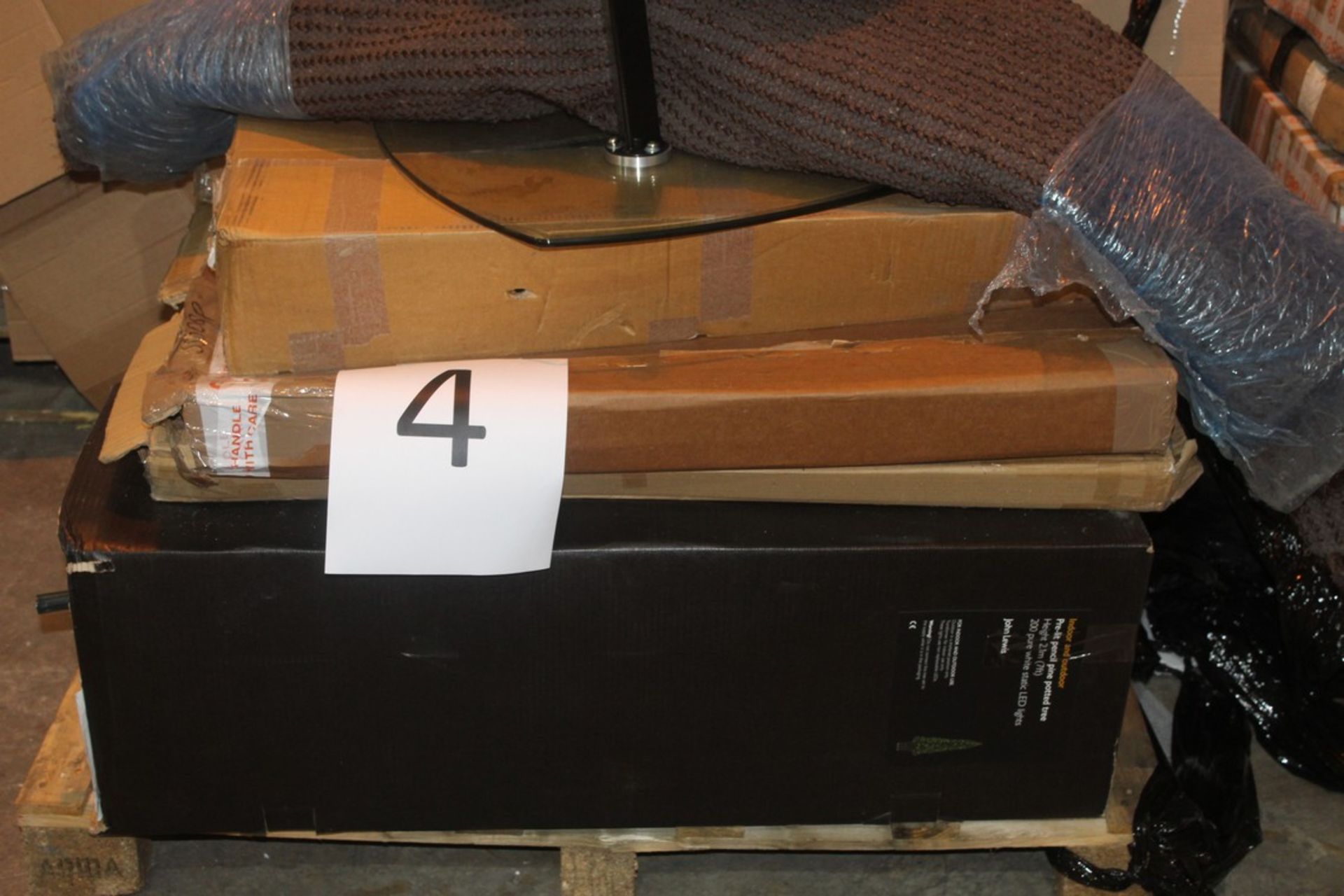 Pallet To Contain An Assortment of Items To Include Floor Rugs, Glass Coffee Tables, Christams