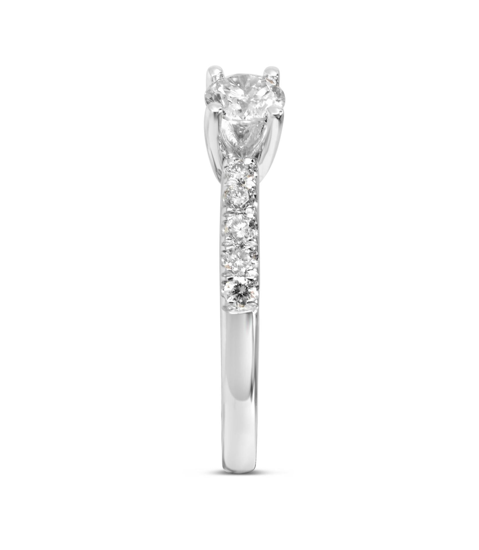 Solitaire diamond ring with diamonds on shoulder