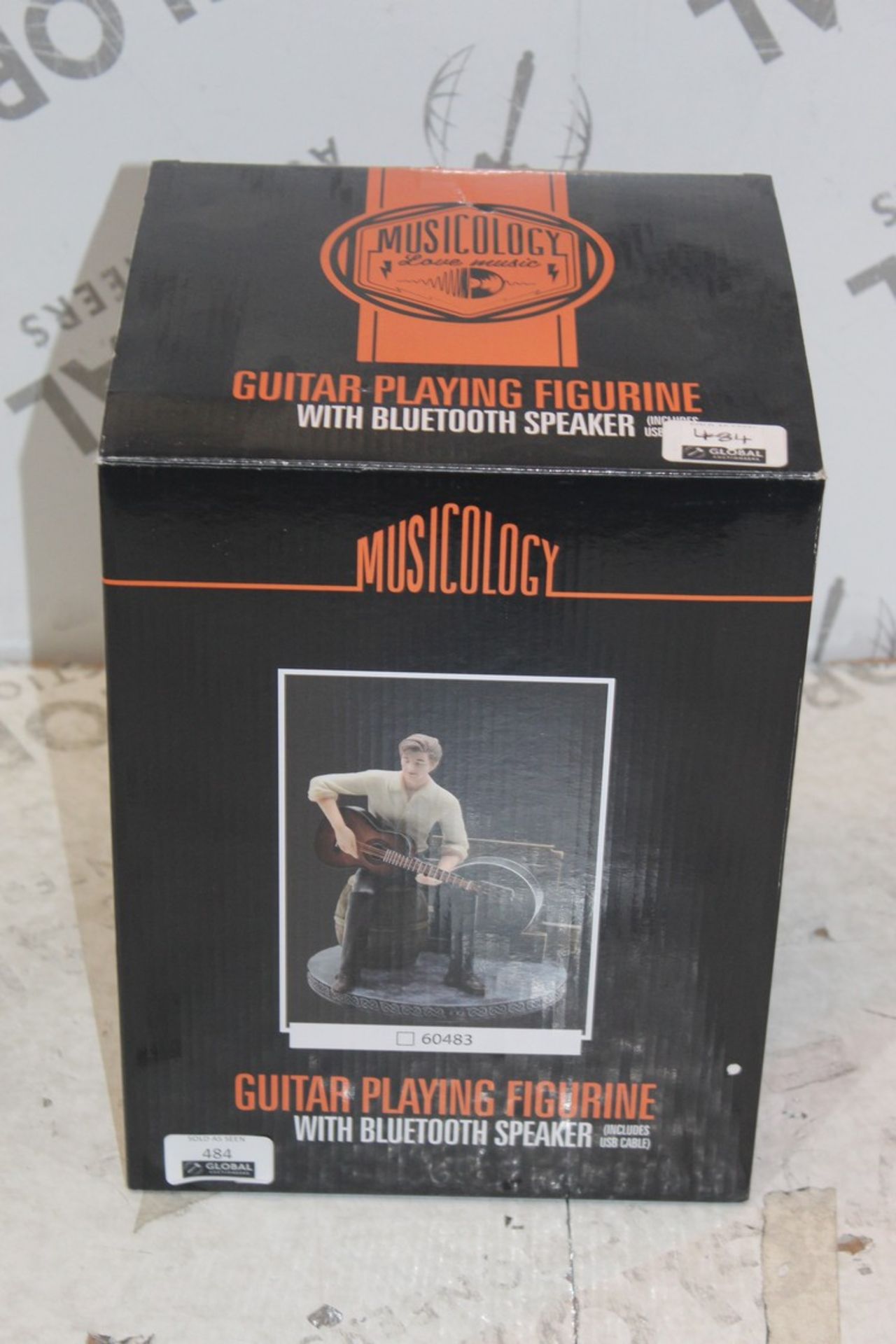 Boxed brand New Musicology Guitar Playing Figurine With Bluetooth Speaker RRP £90 (Appraisals