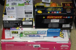 Assorted Children's Toy Items to Include Pac-Man Original IQ Games, Tommy Tunes Spinning Toys,