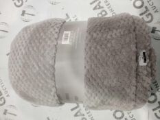 Lot to contain 2 grey designer throws combined RRP £60