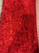 The large fluffy red designer floor rug
