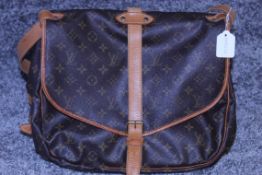 RRP £2500 Louis Vuitton Saumur Shoulder Bag In Brown Coated Monogram Canvas. Condition Rating B (