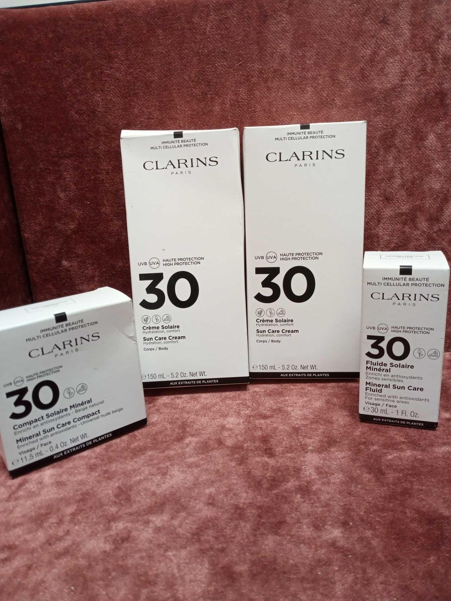 RRP £100 Lot To Contain 4 Boxed Assorted Clarins Paris Suncare Products To Include Mineral Sun Care