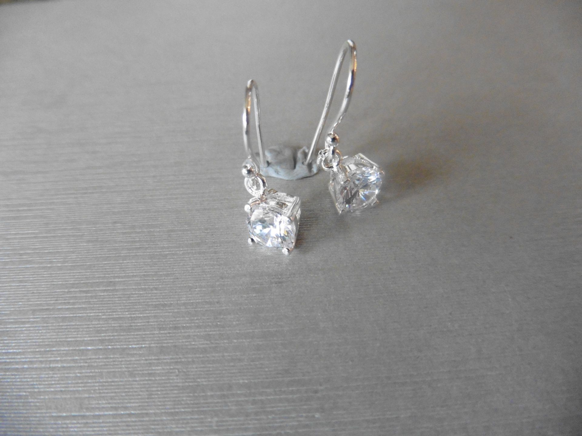 0.80ct diamond drop style solitaire earrings each set with a brilliant cut diamond