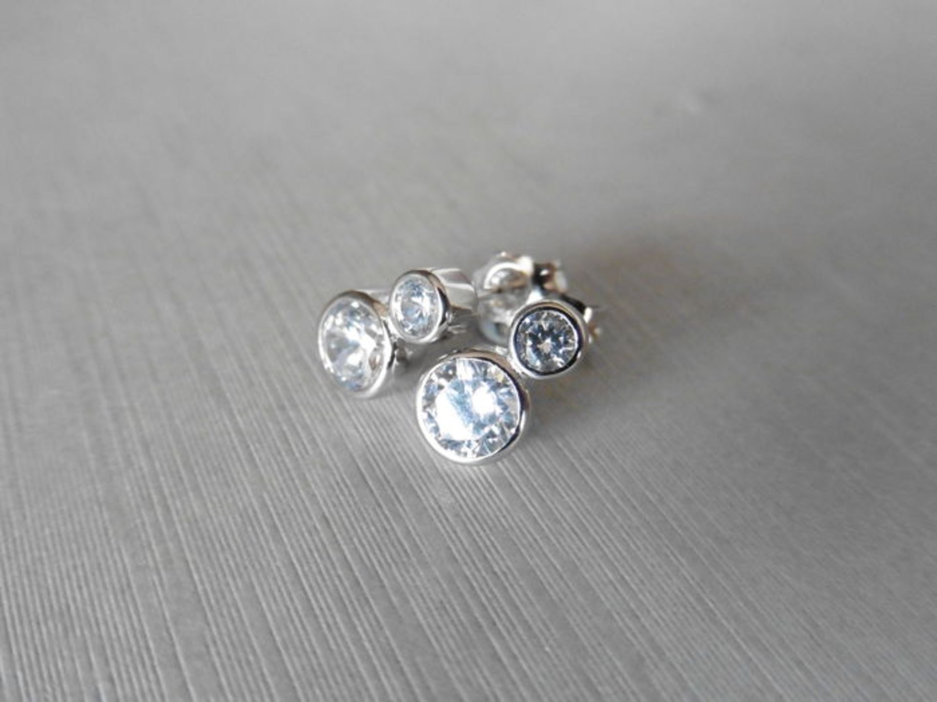 0.80ct diamond drop earrings each set with 2 graduated brilliant cut diamonds