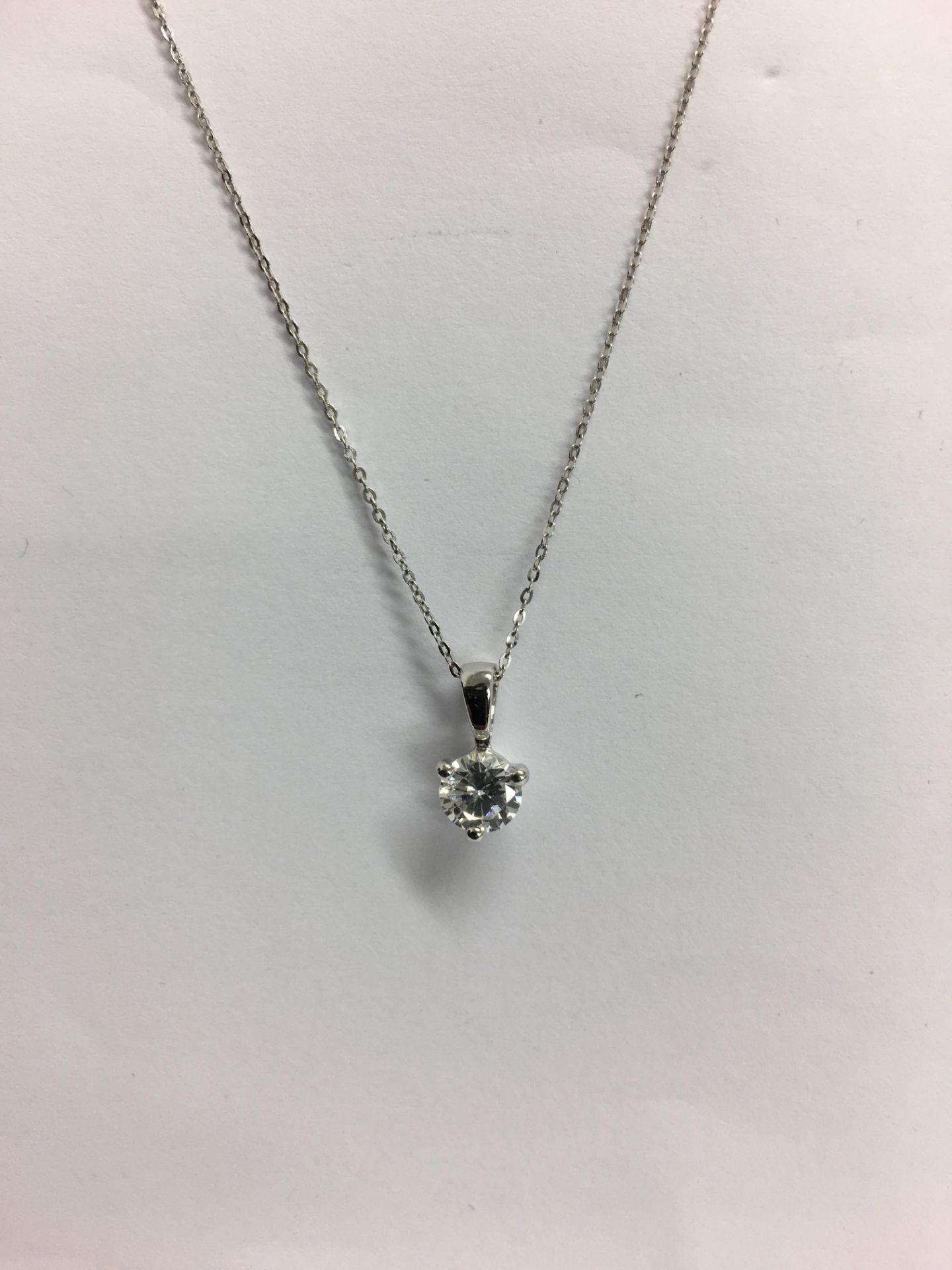 0.40ct diamond solitaire pendant set in 18ct gold. Brilliant cut diamond