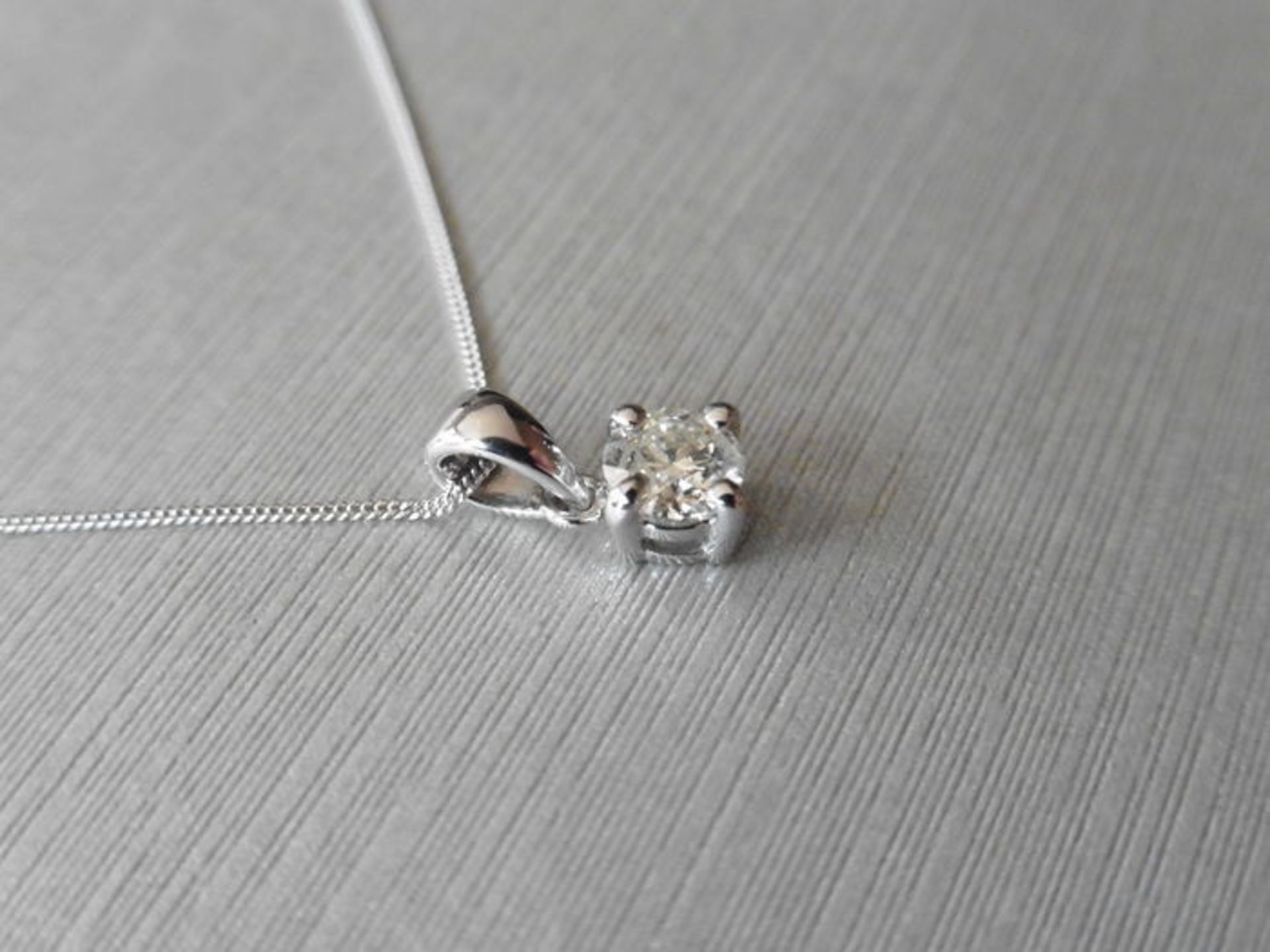 0.20ct diamond solitaire pendant set in 18ct gold. 4 claw setting