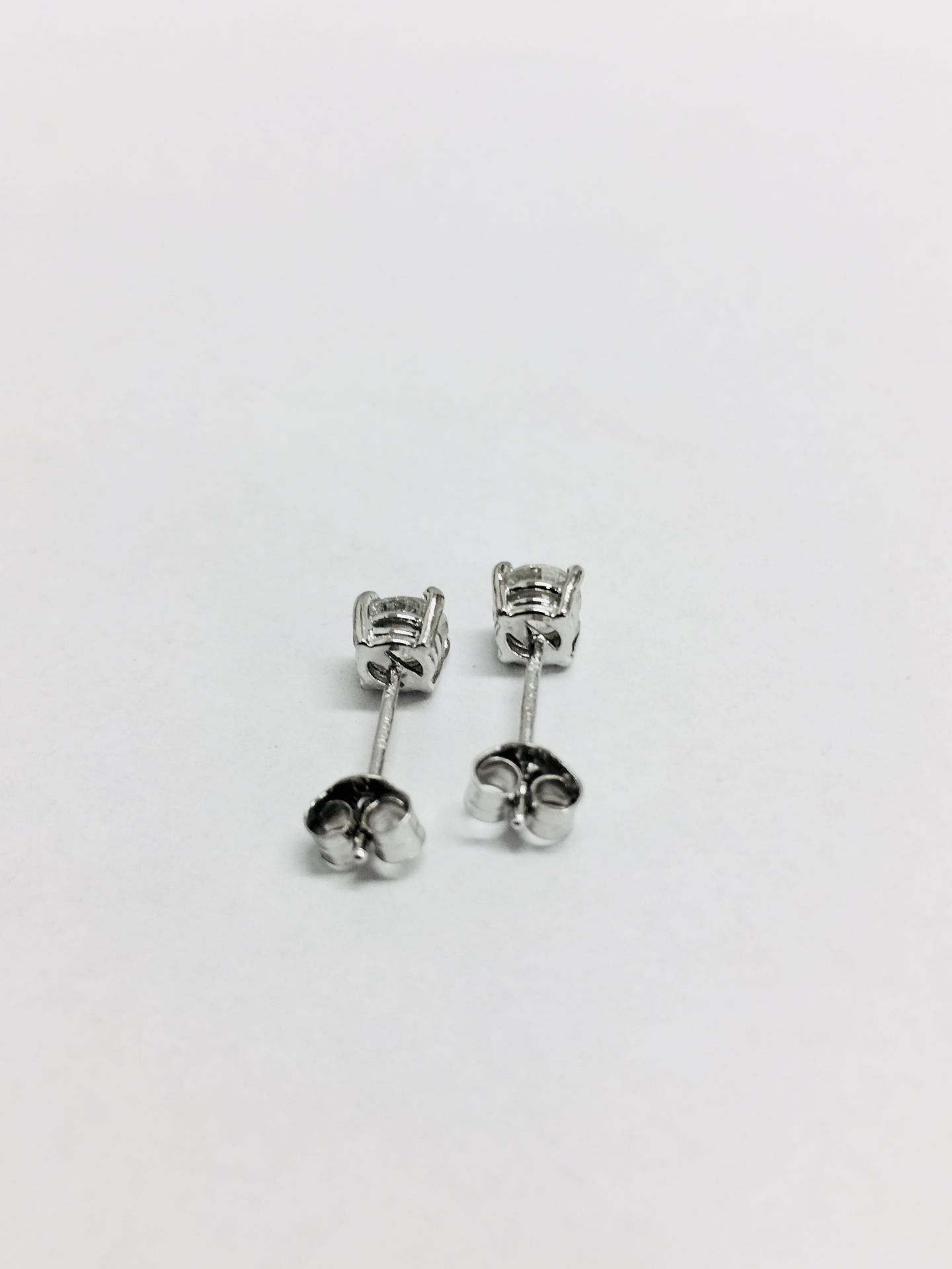 0.90ct Solitaire diamond stud earrings set with brilliant cut diamonds. - Image 2 of 3