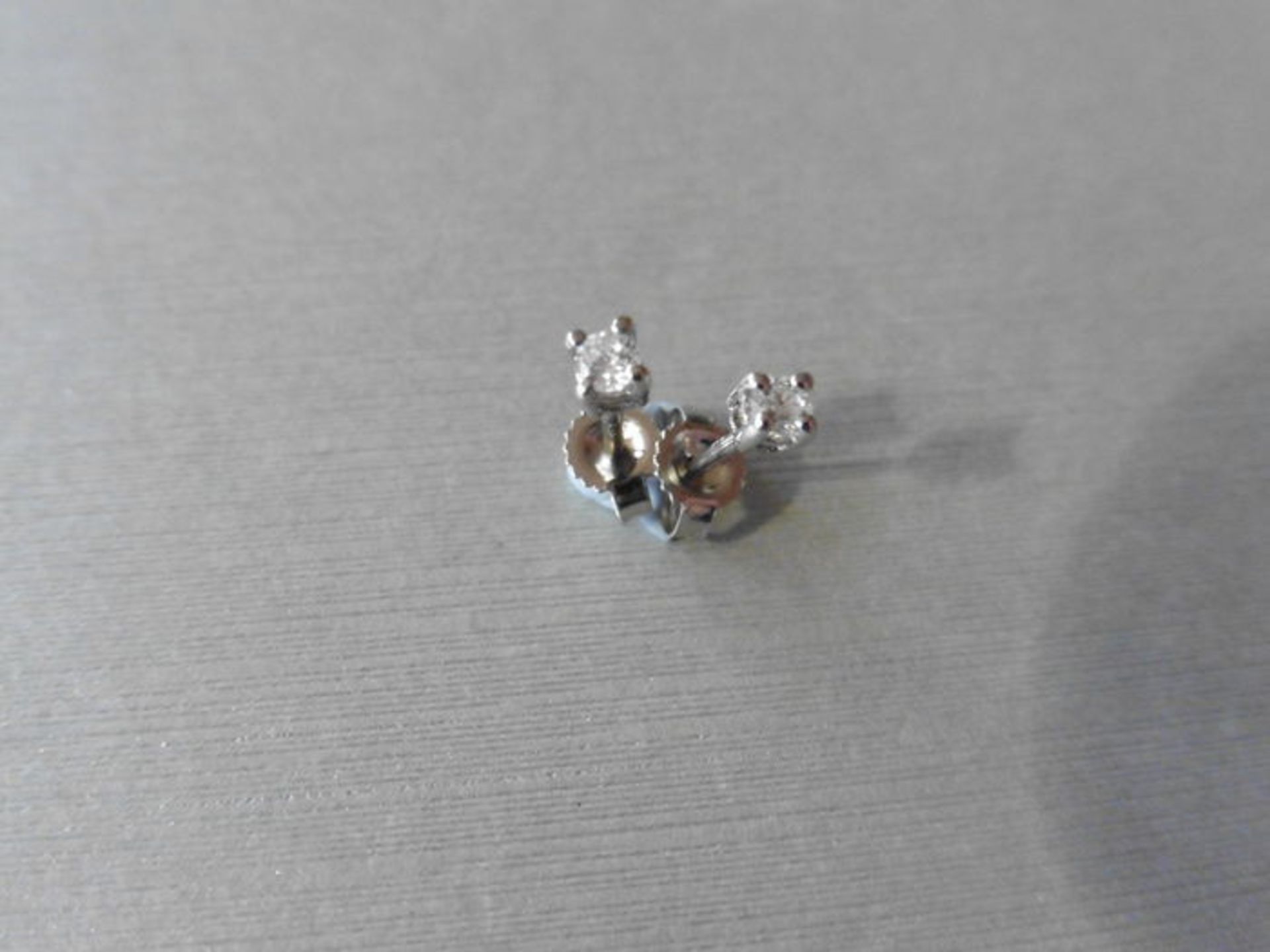 0.15ct Solitaire diamond stud earrings set with brilliant cut diamonds
